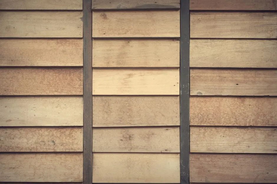 Close-up of light brown wooden wall with horizontal planks. Ideal for rustic decor or backgrounds.